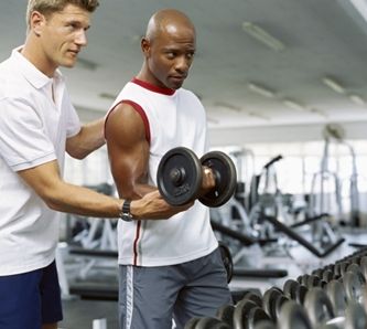 personal-trainer-trains-with-dumbbell.JPG